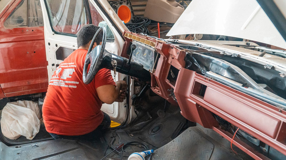 Car accessory upgrade order India 2026 - car interior stripped to bare floor with dashboard removed during installation, showing why upgrades should be sequenced by teardown