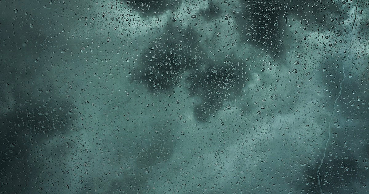 Car driving in rain monsoon India