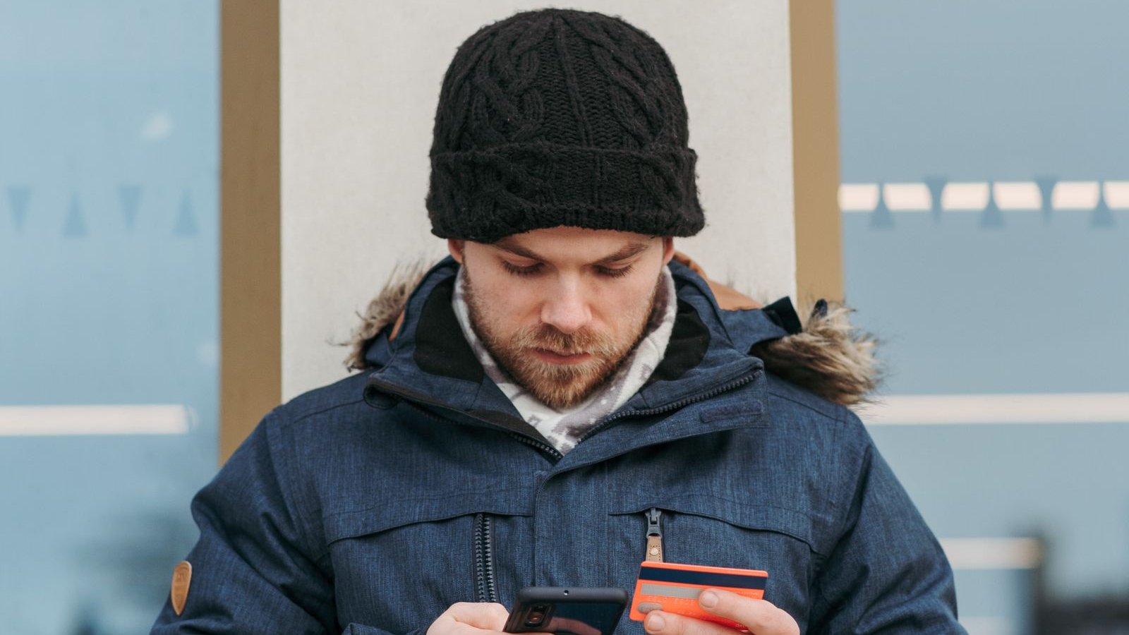 Person shopping online on a smartphone with a credit card - how to shop India festive car accessory sales 2026, spot fake discounts and what is worth buying