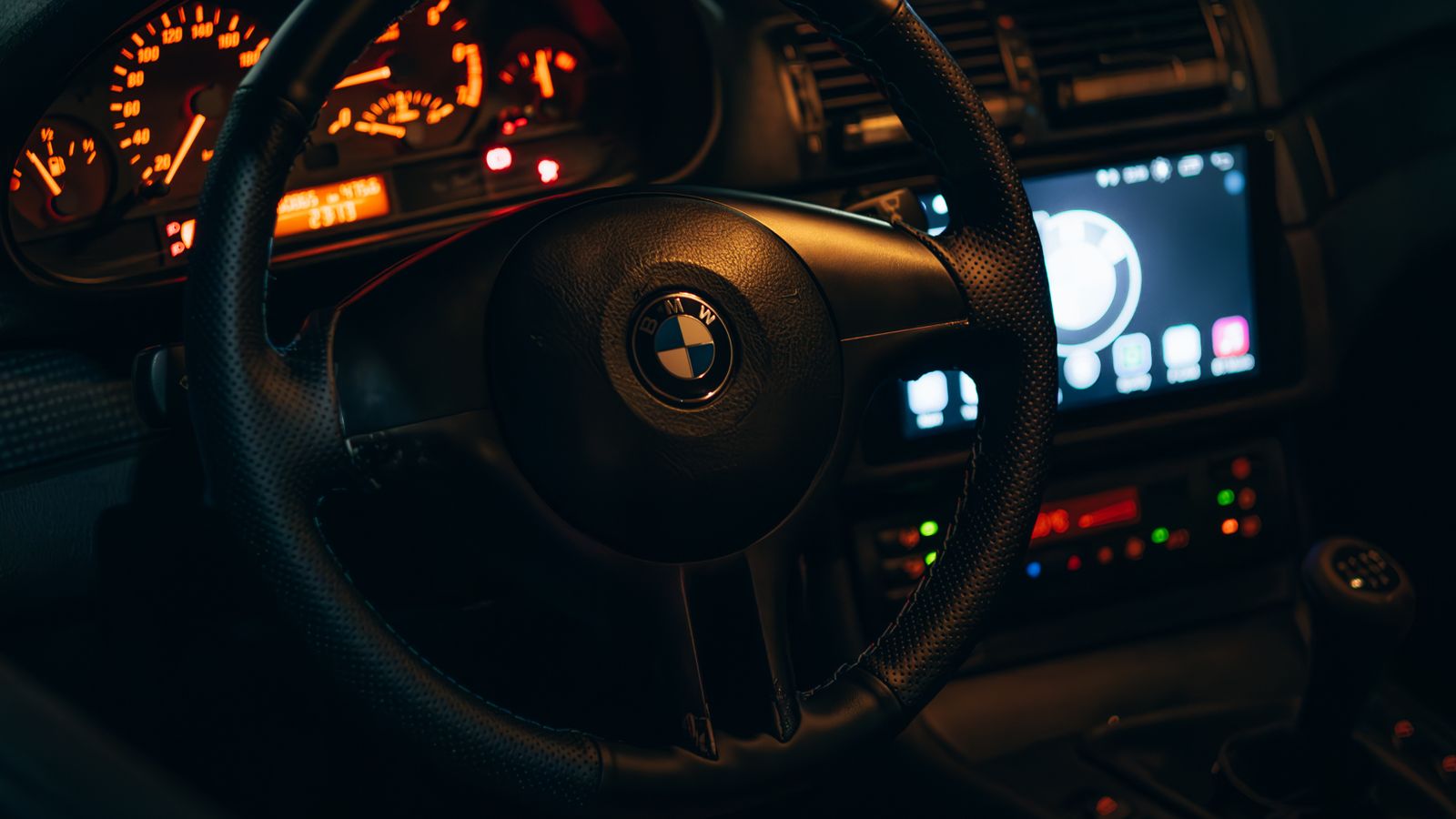 Car ambient lighting legal India 2026 - dark car interior at night with warm ambient glow on dashboard, instrument cluster and console, CMVR Rule 108 internal lighting exemption
