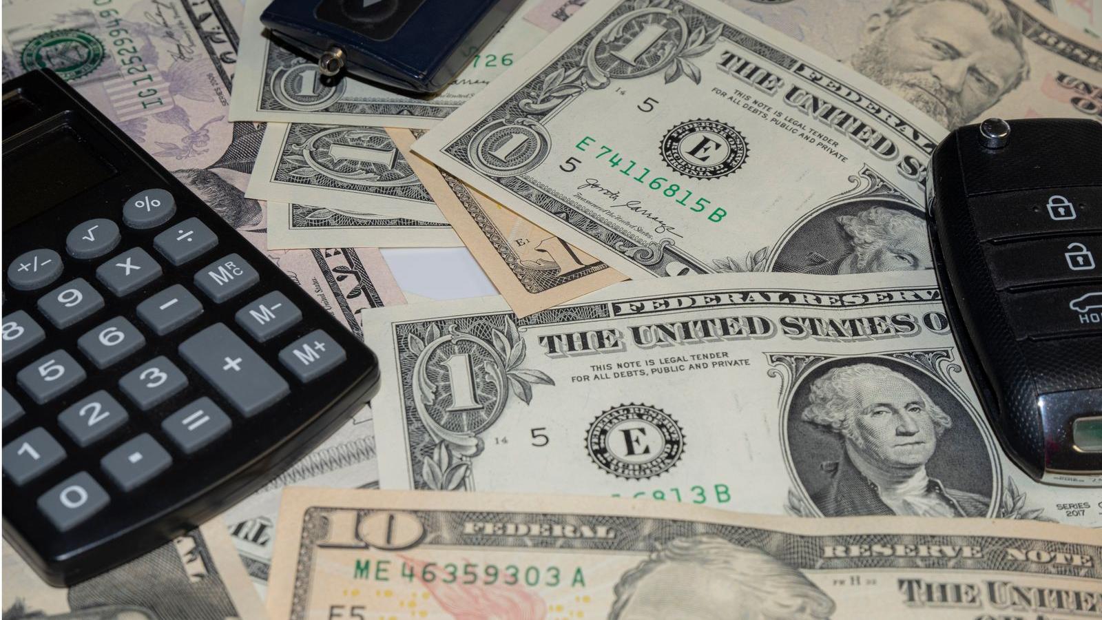 Car keys and a calculator on Indian currency notes - India car accessory dealer markup report 2026, dealer vs aftermarket price data and how much you can save