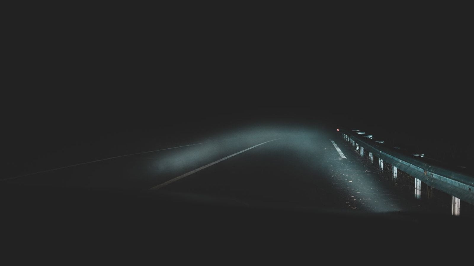 Car headlights on a dark foggy road at night in India - auxiliary light bar legality guide 2026, where off-road driving lights are legal and the road-legal night-vision stack of projector headlights and fog lamps