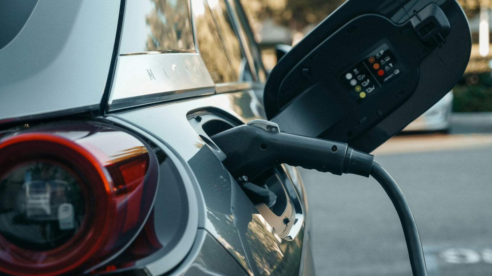 EV aftermarket field guide India 2026 - electric car charging port close-up, dash cam reverse camera head unit install rules for Nexon EV, MG Windsor, BYD Atto 3, Comet, Punch EV, Tiago EV, Mahindra BE 6