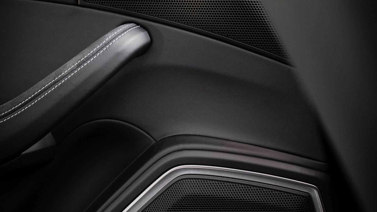 Car accessory install substitution India 2026 - close up of a sealed car door panel with speaker grille, the trim that hides speakers wiring and damping after fitment
